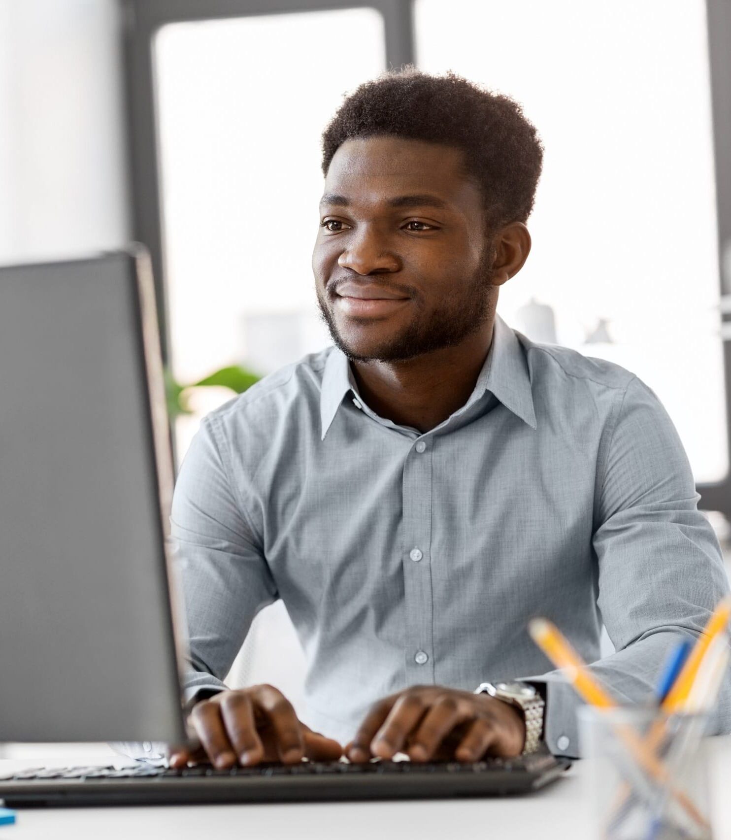 african businessman with computer at office Innovative Mailing Solutions for Businesses